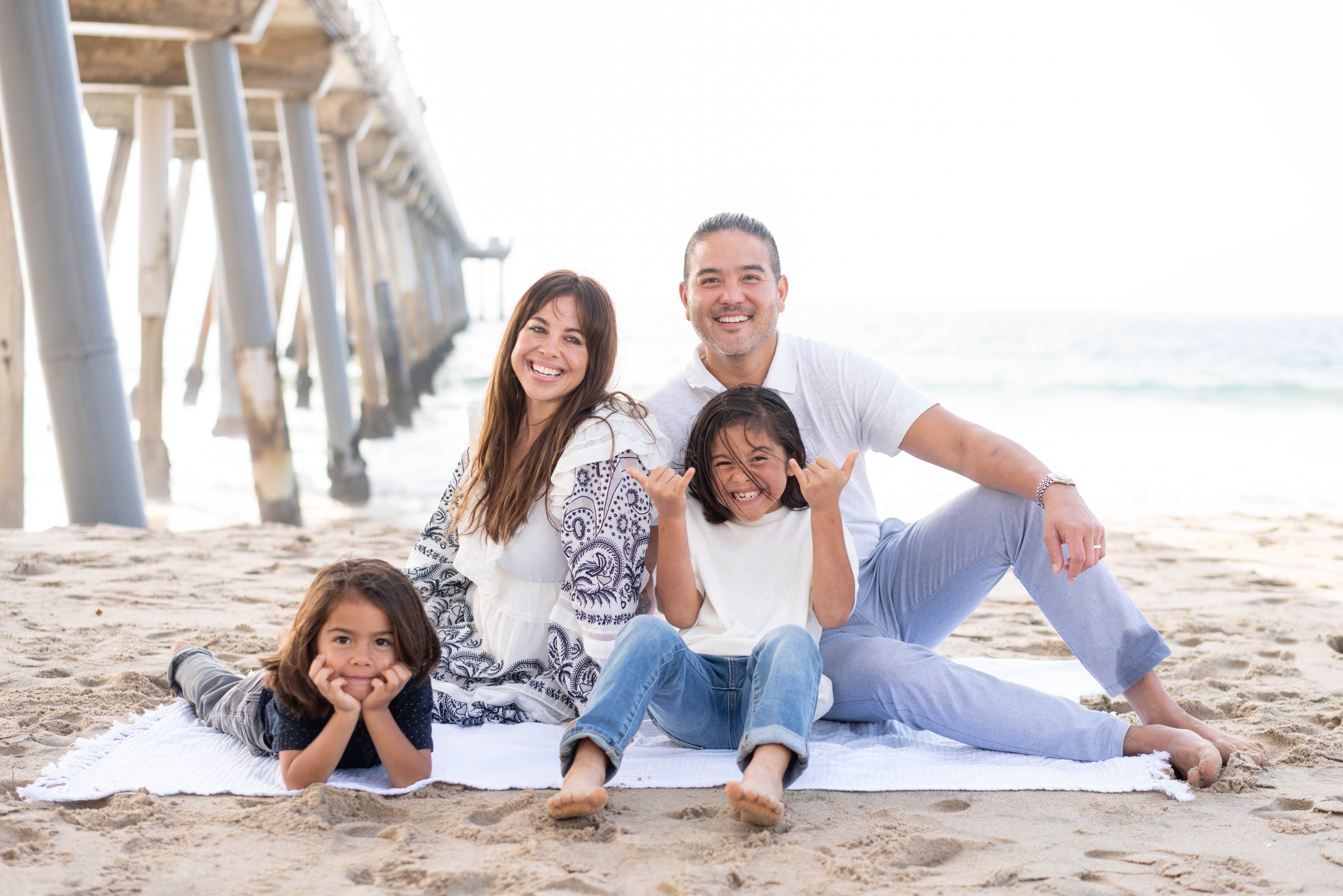 Chris Wong, founder of Local AI, with his family at the beach